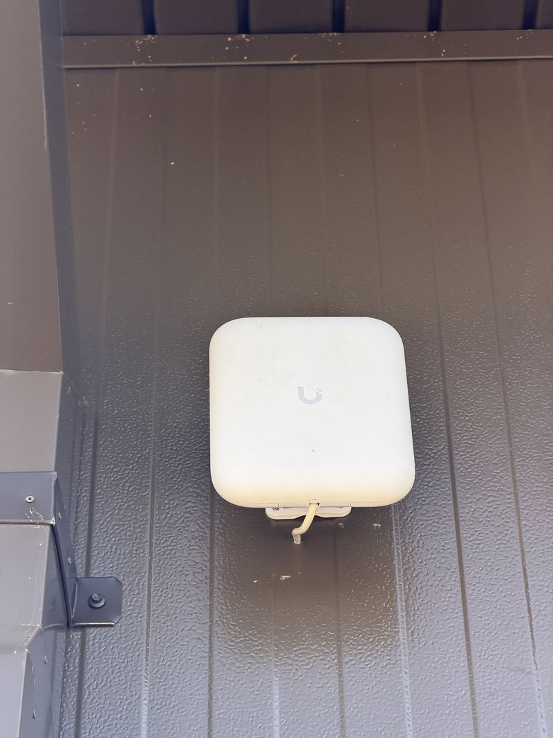 UniFi U7 Pro Outdoor access point under the eave at The Journey Home