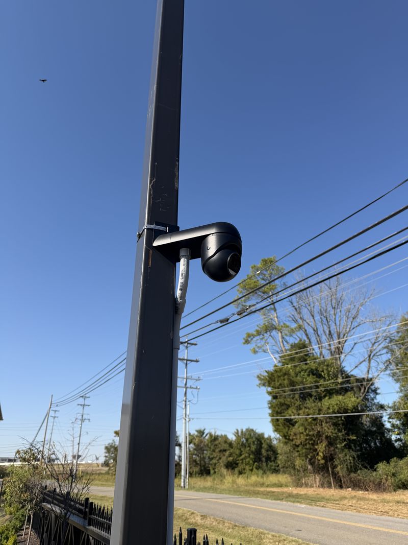 UniFi camera on a light pole beside the lot at The Journey Home